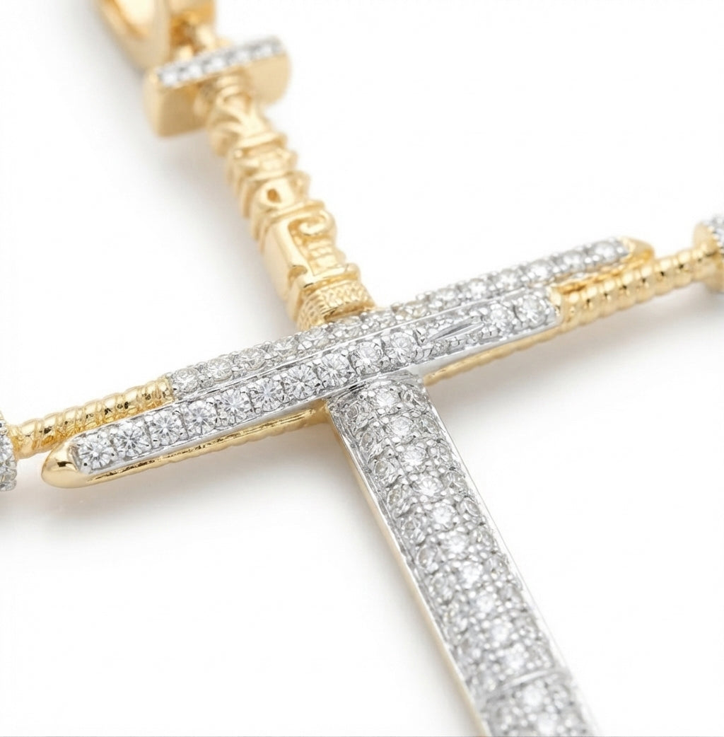 Close-up of natural diamonds on 10K yellow gold men's cross charm