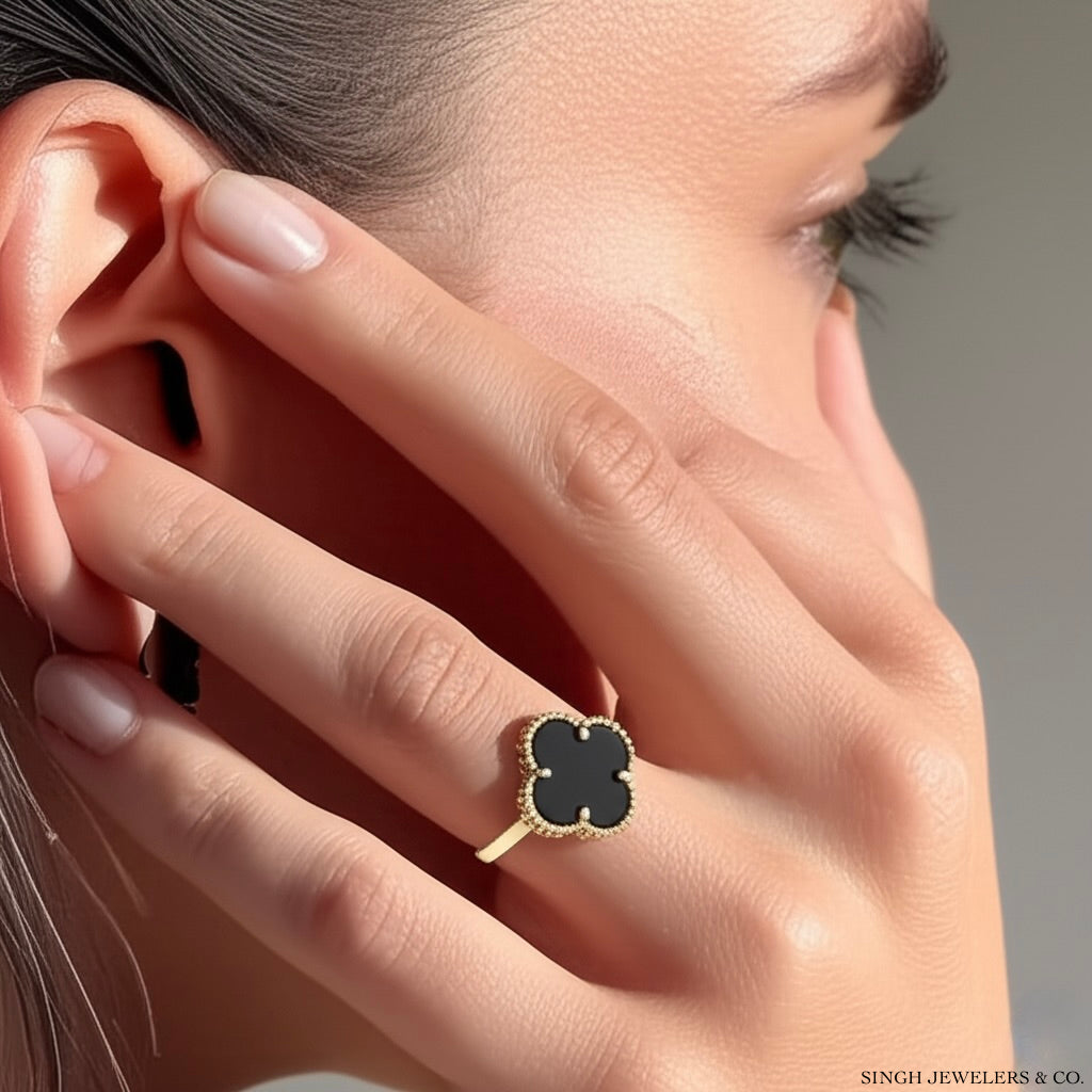 Model wearing 10K black clover ring