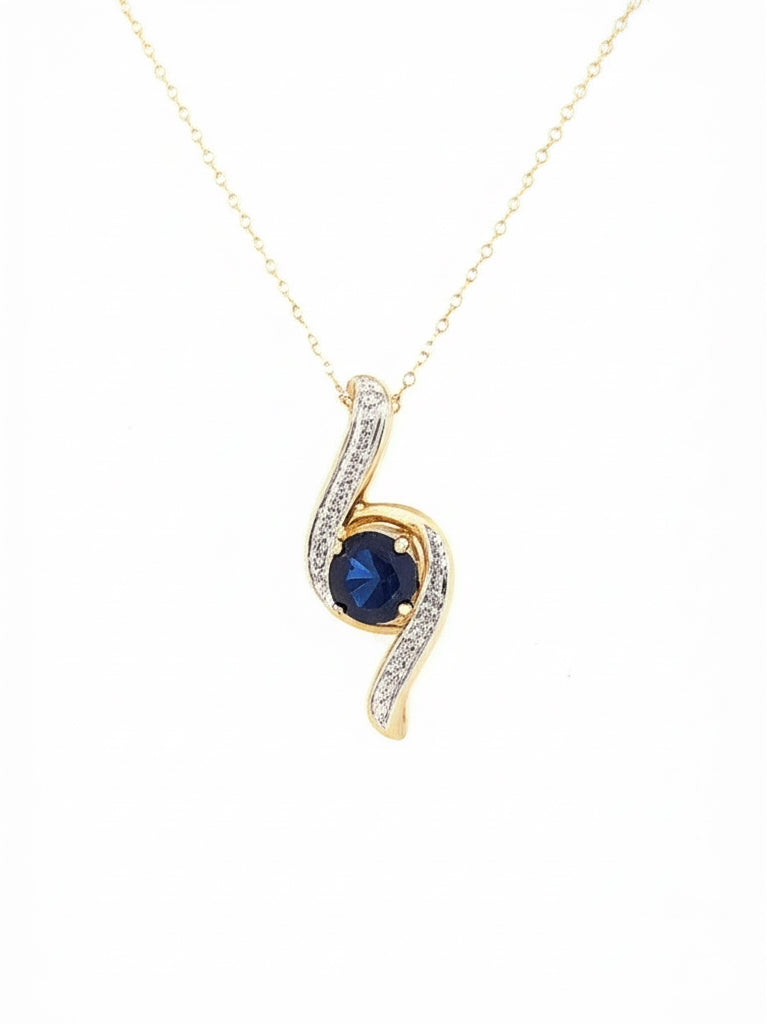 10K gold pendant featuring a 1.02 carat oval blue sapphire with diamond accents