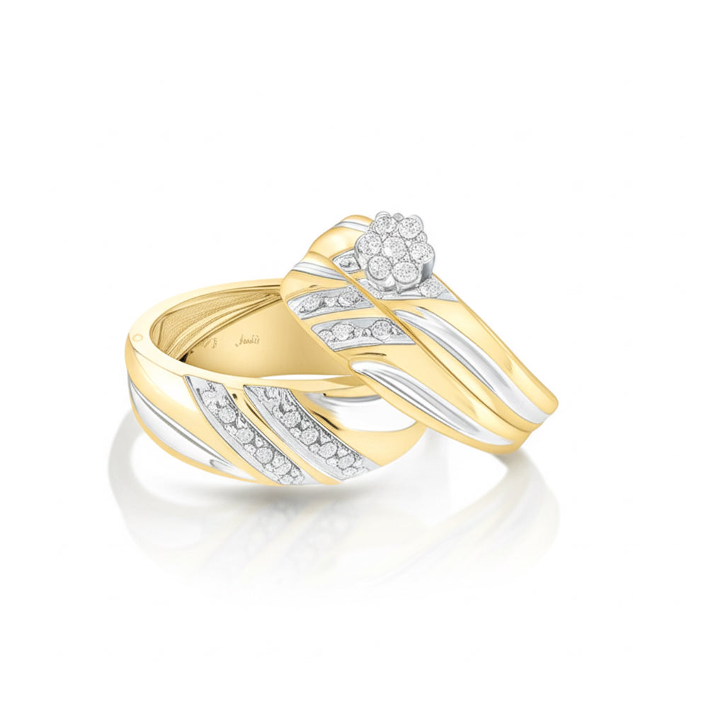 Gold and silver ring with diamond accents on a white background
