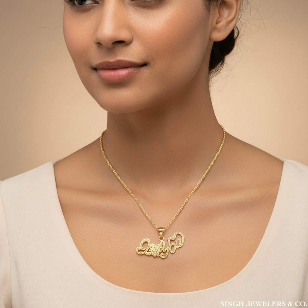 Woman wearing a gold necklace with a pendant on a beige background