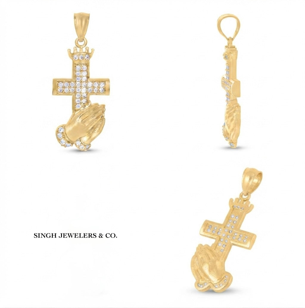 Close-up of praying hands and cross design on 10K yellow gold pendant