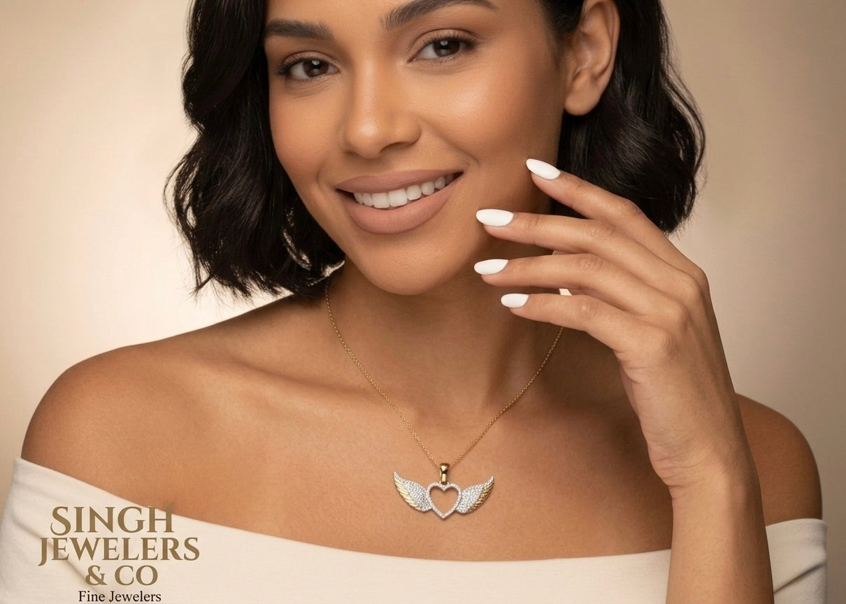 Elegant heart with wings diamond pendant featuring 1/4 CTW round diamonds