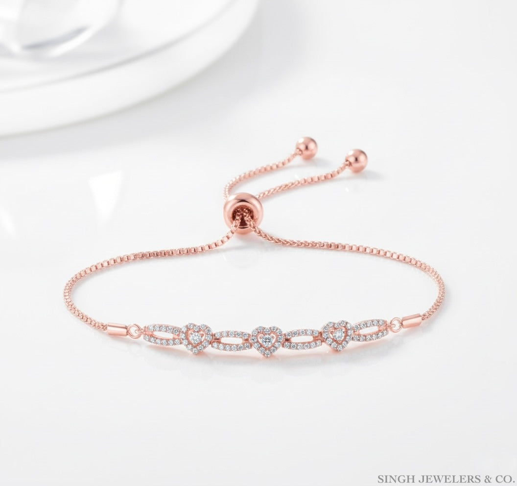 Rose gold bracelet with diamond accents on a white background, featuring the brand 'Singh Jewelers & Co'.