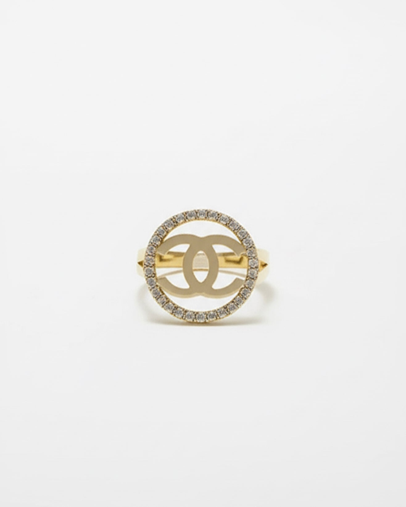 10K yellow gold split shank ring with white sapphires and white gold Chanel-style logo