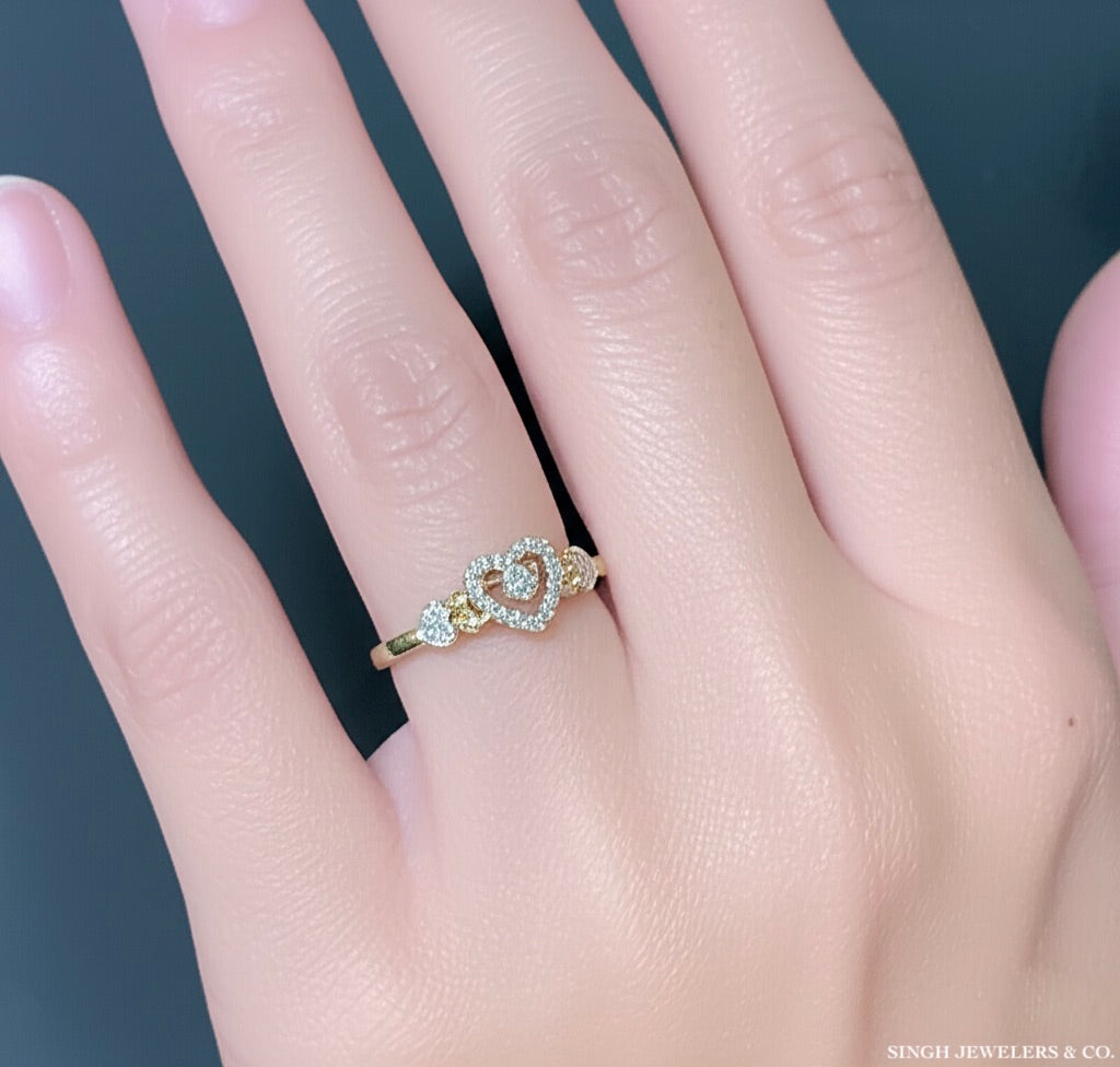 Front view of a 10k yellow gold heart-shaped diamond promise ring with 0.20 cttw