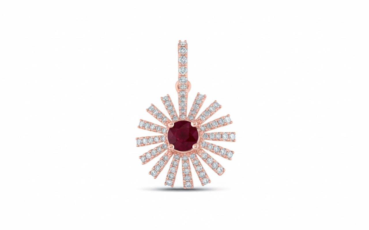 Rose gold pendant with a central red gemstone and diamond-studded rays on a white background