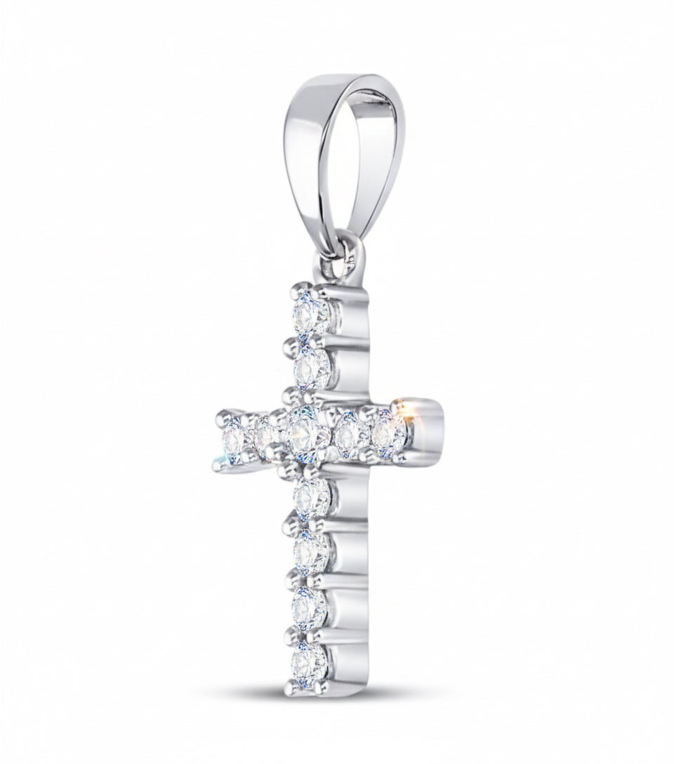 Silver cross pendant with diamonds on a white background