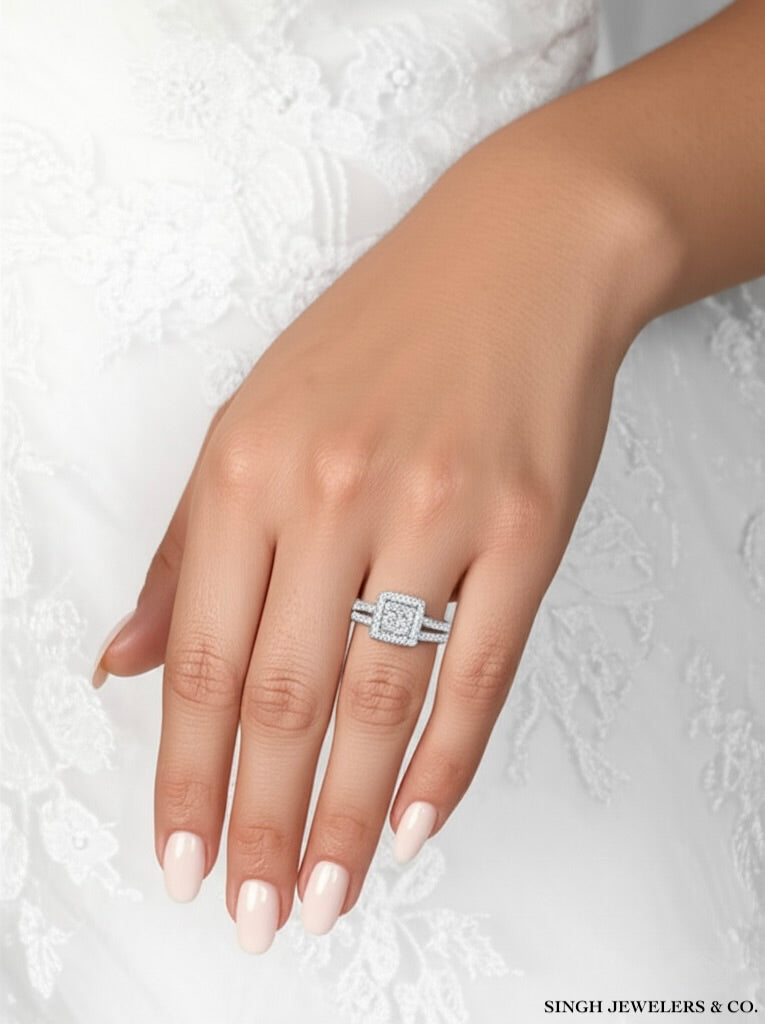 Silver ring with a diamond on a hand against a textured white background