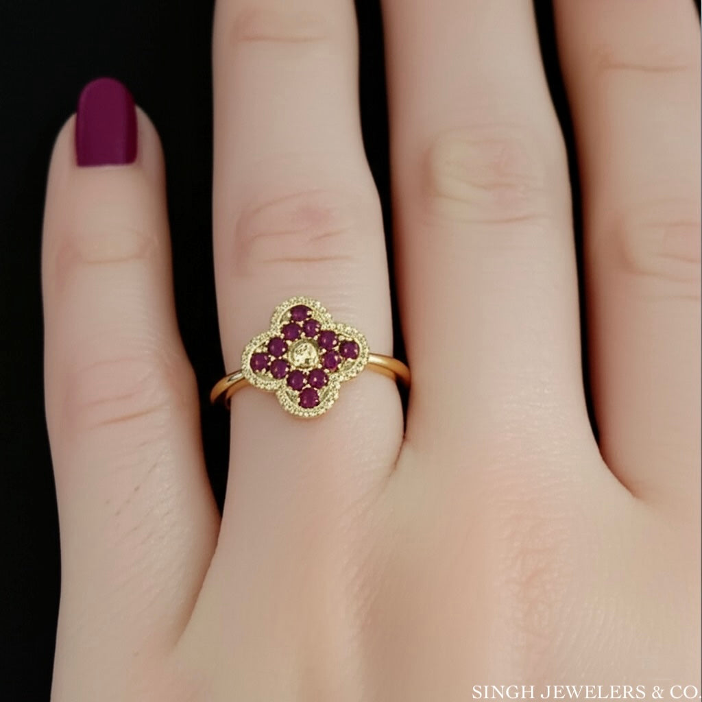Model wearing a 14k yellow gold 1/2 CT natural ruby clover ring – elegant gemstone jewelry