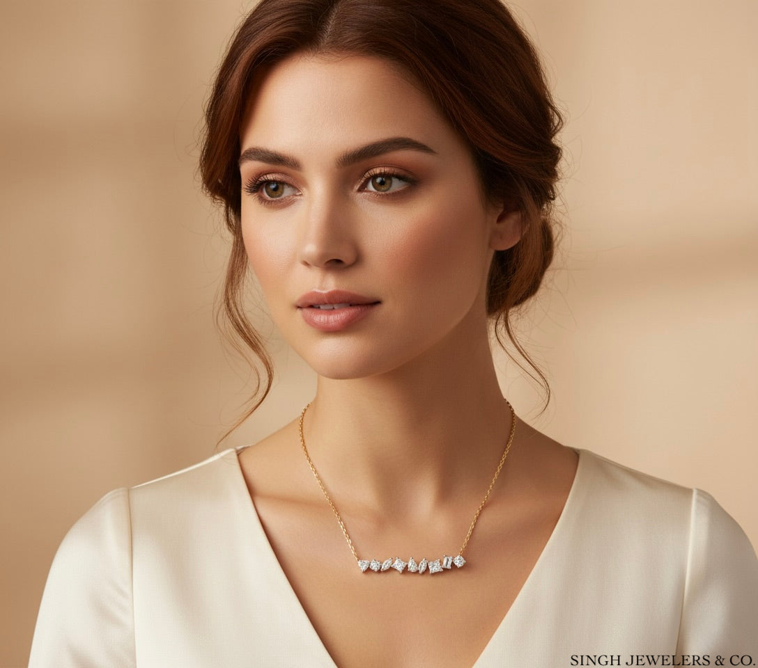 Woman wearing a gold necklace against a beige background with 'Singh Jewelers & Co.' branding.