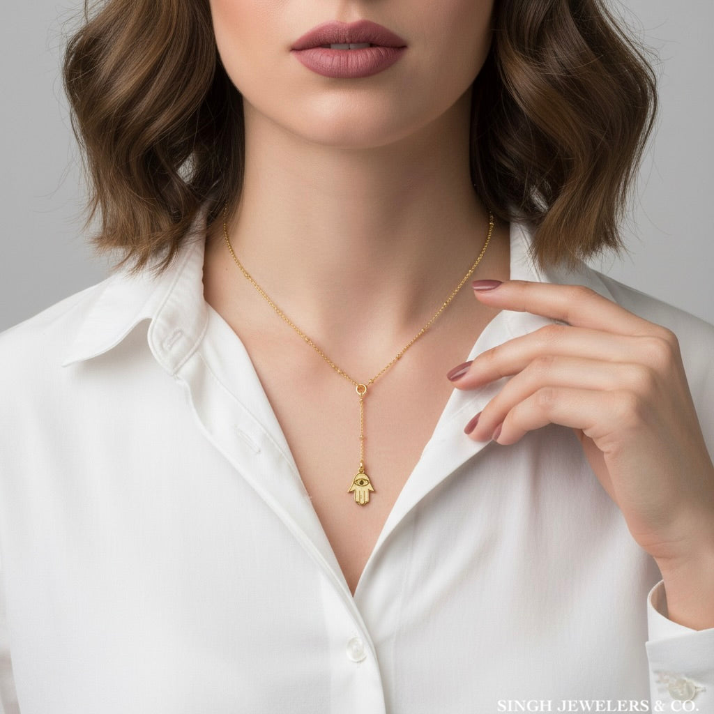 14k Yellow Gold Hamsa Necklace worn on model – Elegant Protective Jewelry for Women
