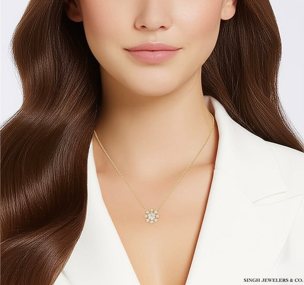 Model wearing 14k yellow gold Nicolina flower necklace with 1/3 CTTW round diamonds on an 18-inch chain