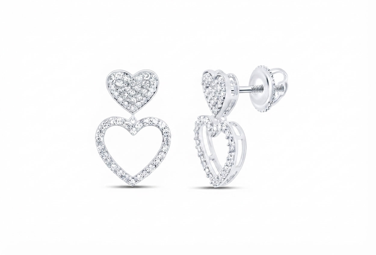 Elegant natural diamond heart dangle earrings crafted in 10K white gold. A timeless jewelry gift for anniversaries, birthdays and special moments.