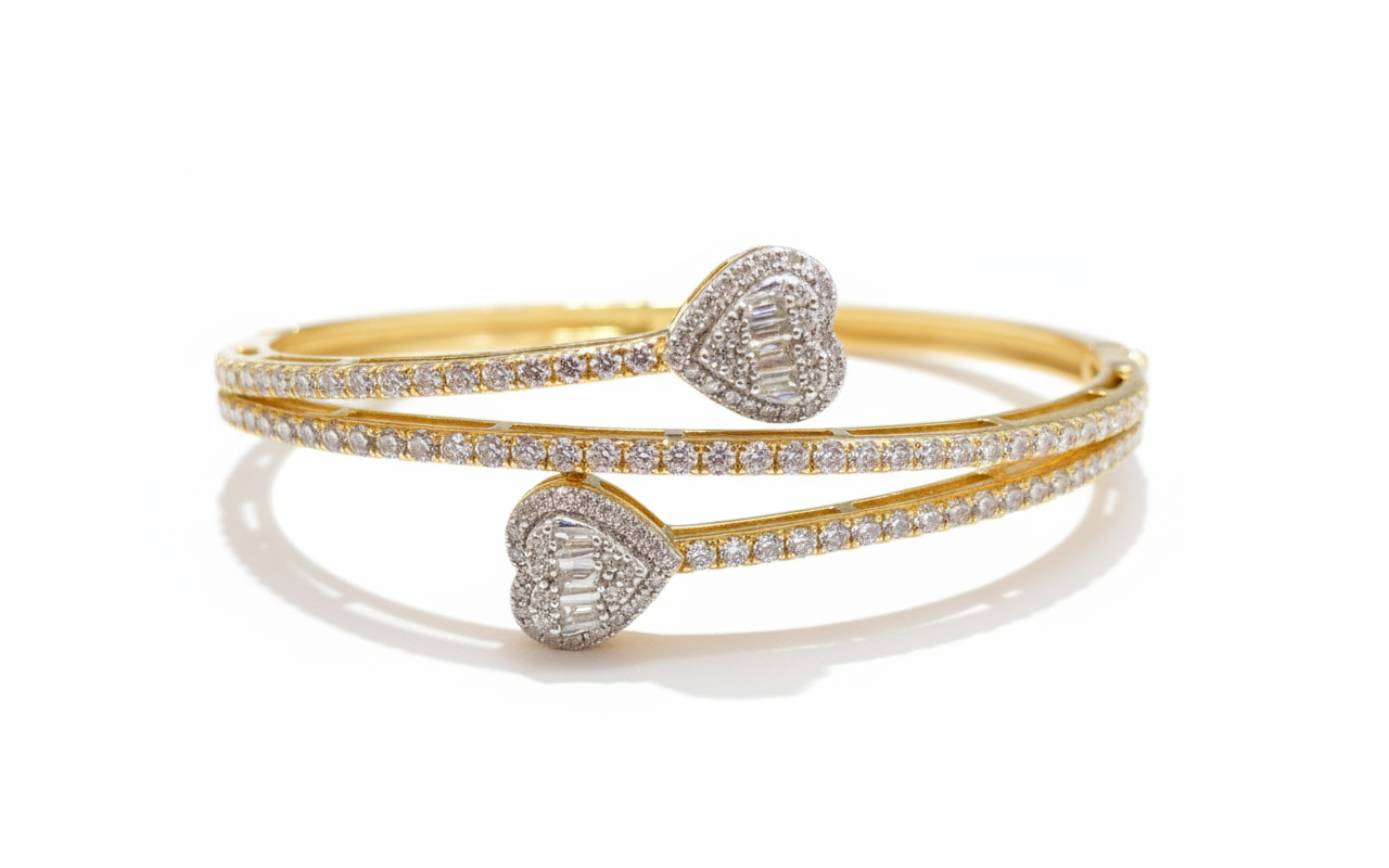 Gold and silver heart-shaped bangles on a white background