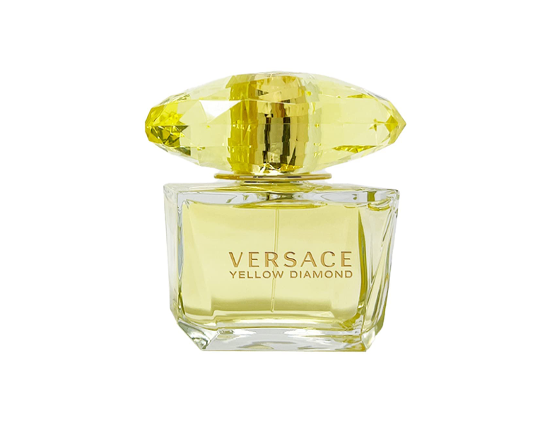 Versace Yellow Diamond perfume bottle – a clear glass flacon with faceted edges, topped with a large yellow gem-like cap, showcasing the bright golden fragrance inside.