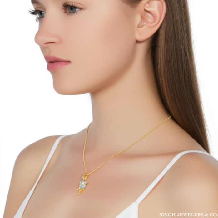 Model wearing 10K yellow gold rose charm necklace, 18-inch chain