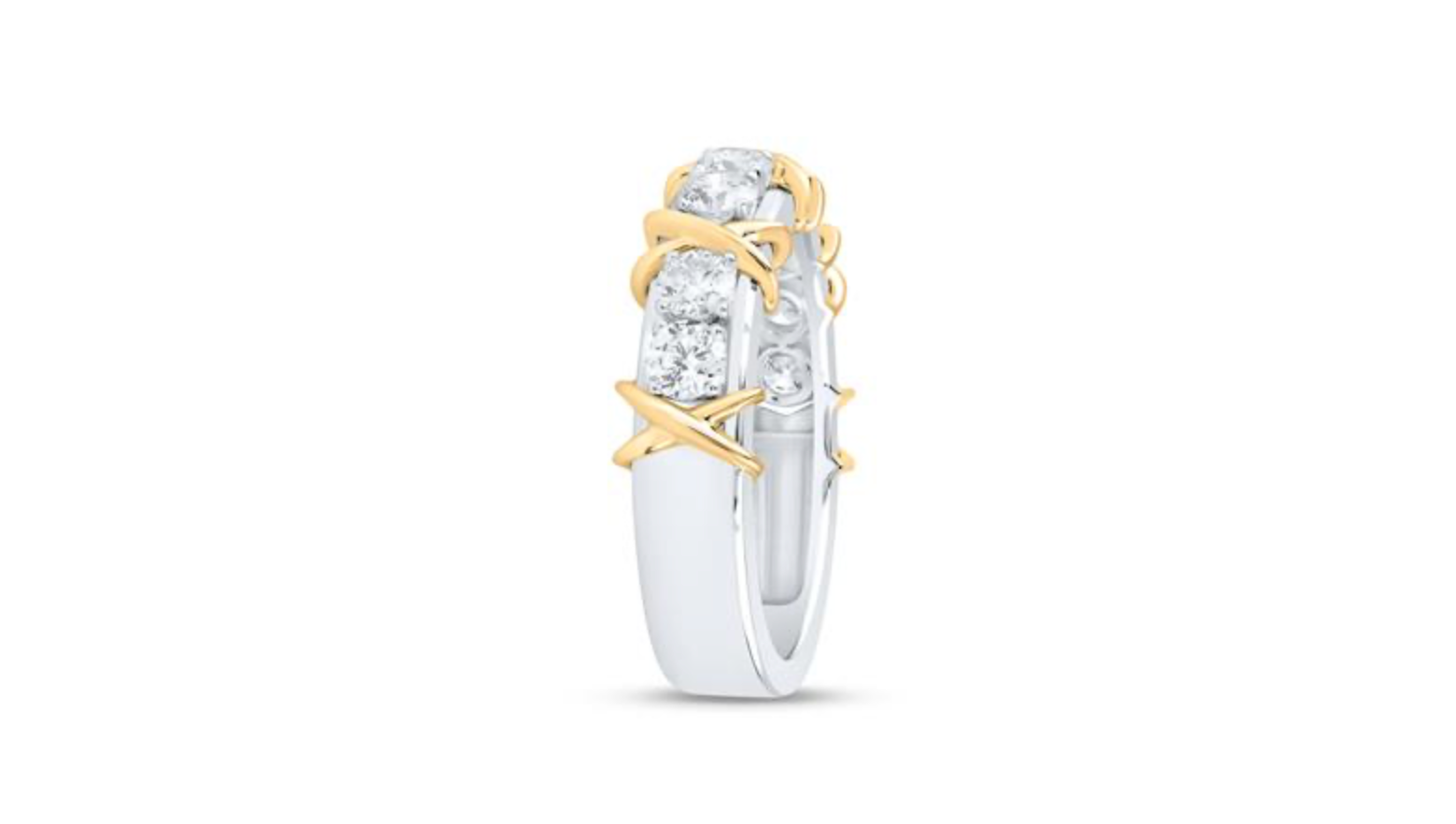 Two-tone ring with gold and silver design on a white background