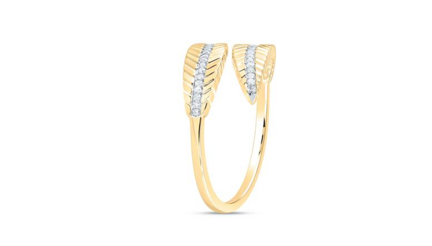 Gold ring with diamond accents on a white background