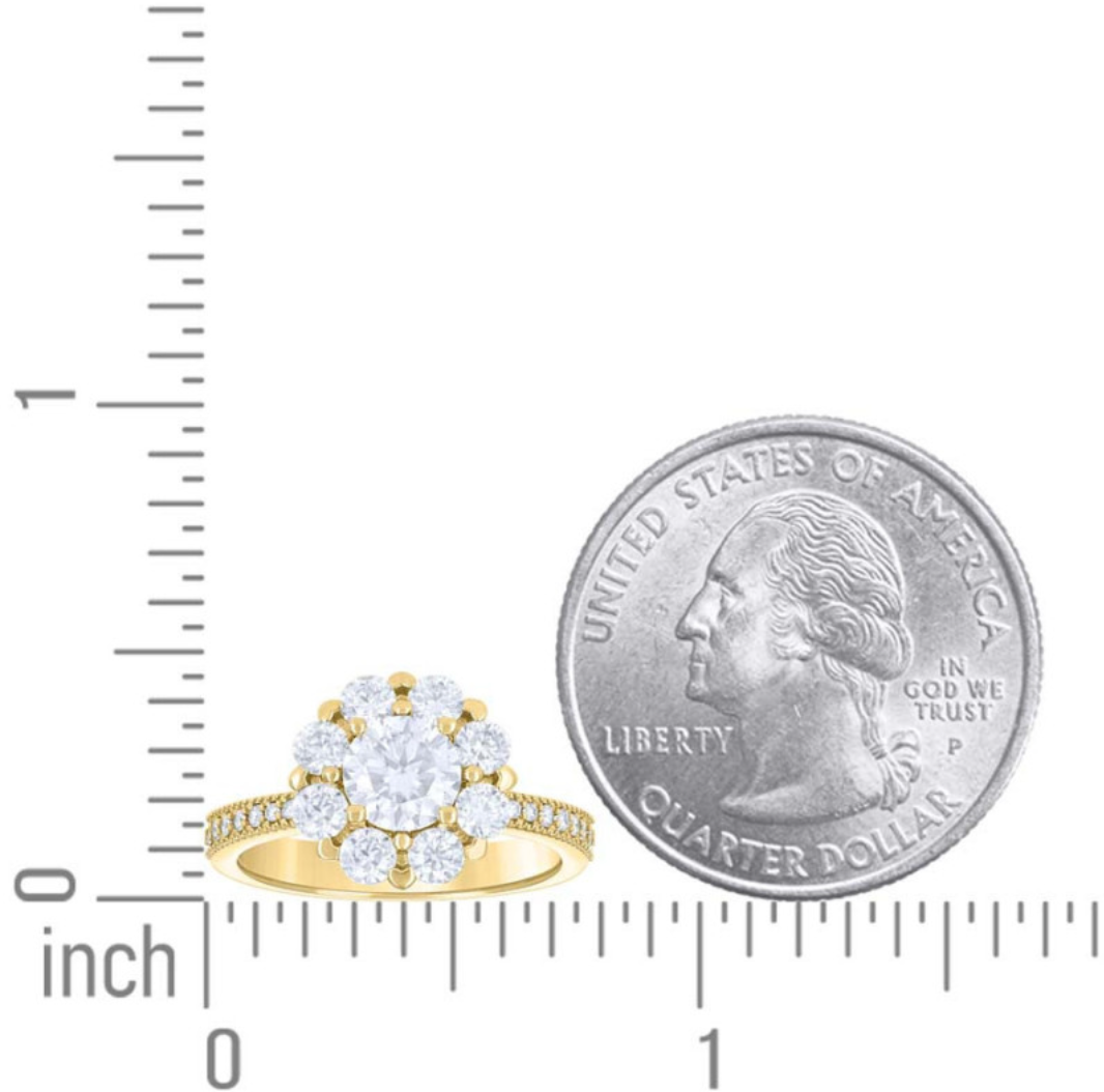 Gold ring with clear stones next to a quarter for size comparison on a white background