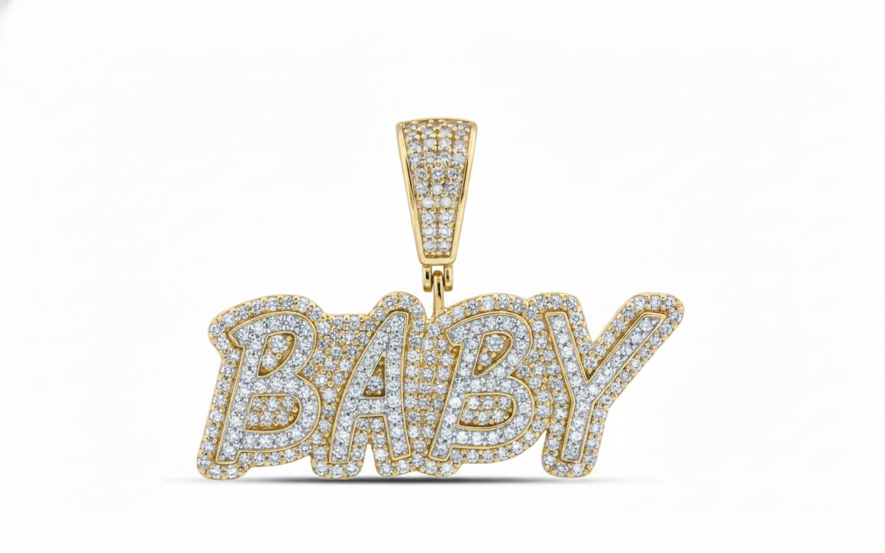 Gold 'BABY' pendant with diamonds on a white background
