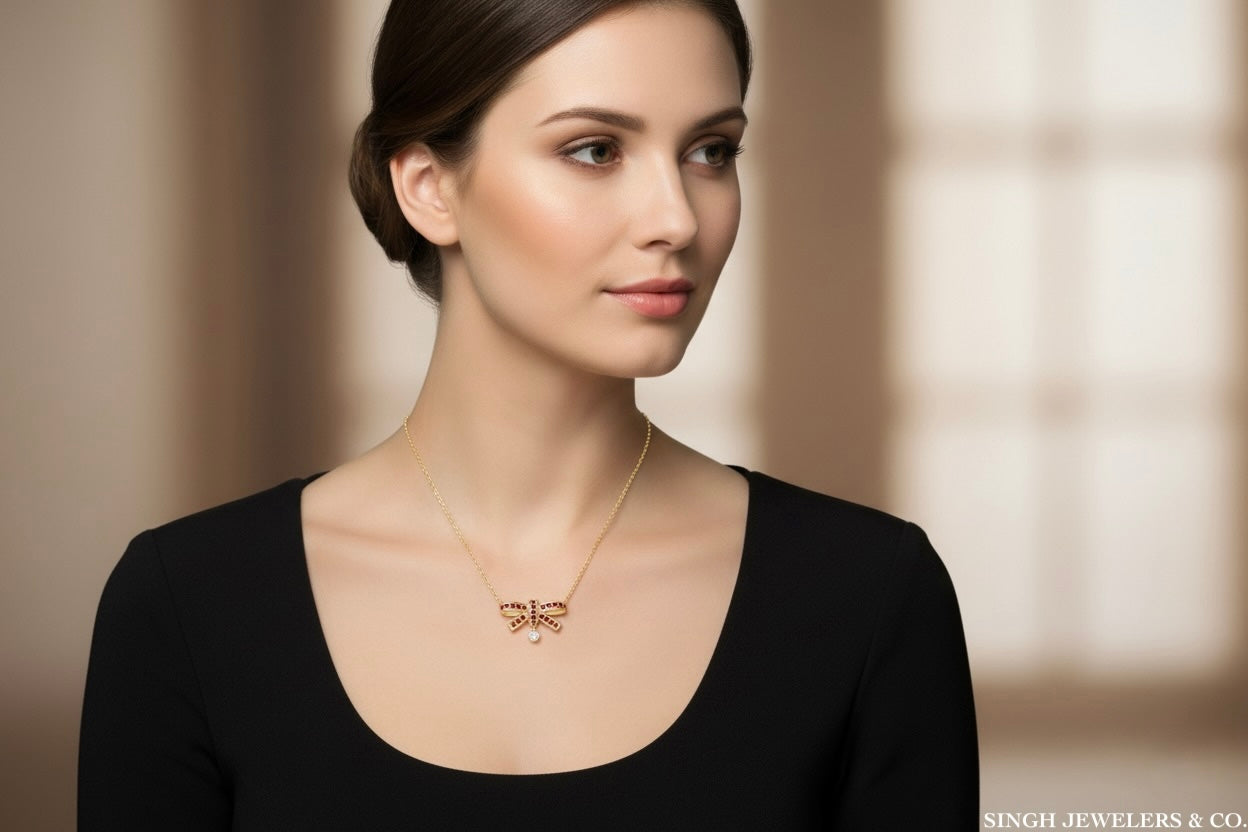 14K yellow gold bow necklace with 1/3 carat gemstone and natural diamonds on 18 inch chain