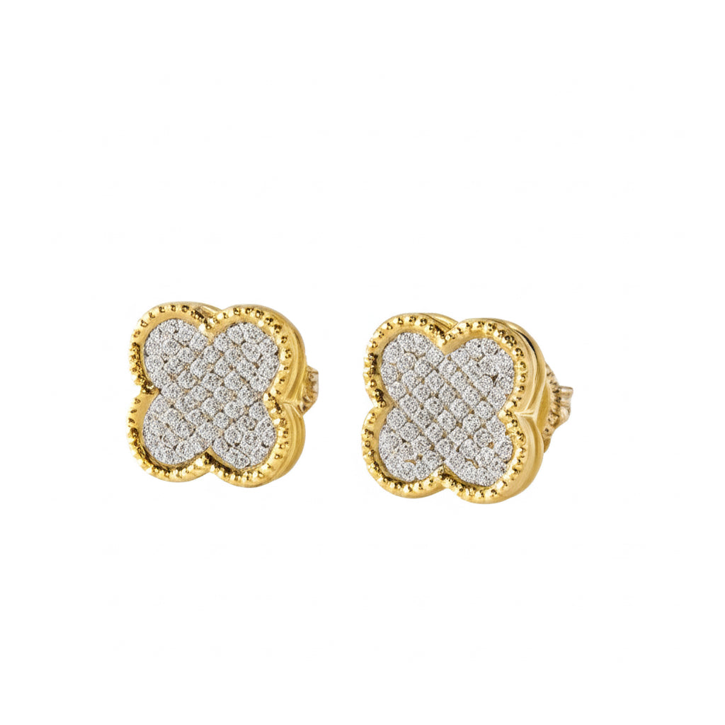 Gold and diamond earrings on a white background
