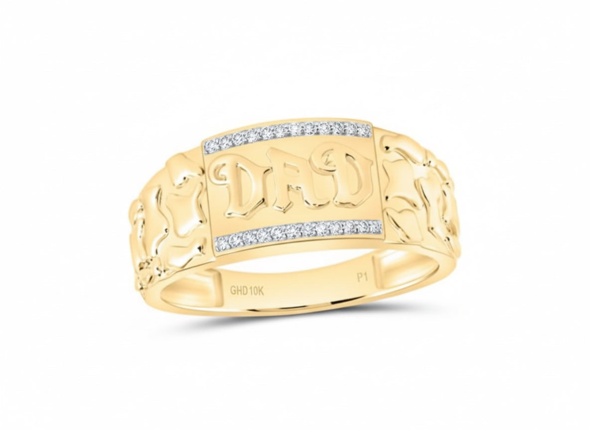 Gold ring with 'DAD' engraving on a white background