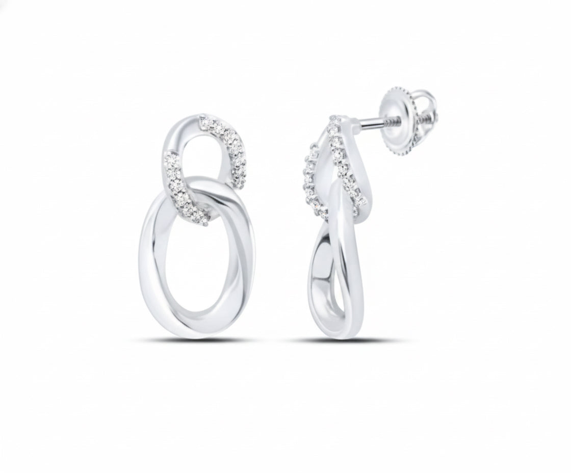 Pair of silver earrings on a white background