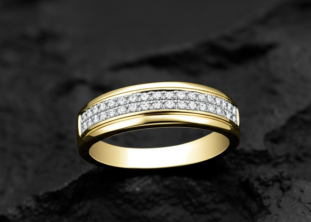 Gold ring with diamond accents on a dark textured background