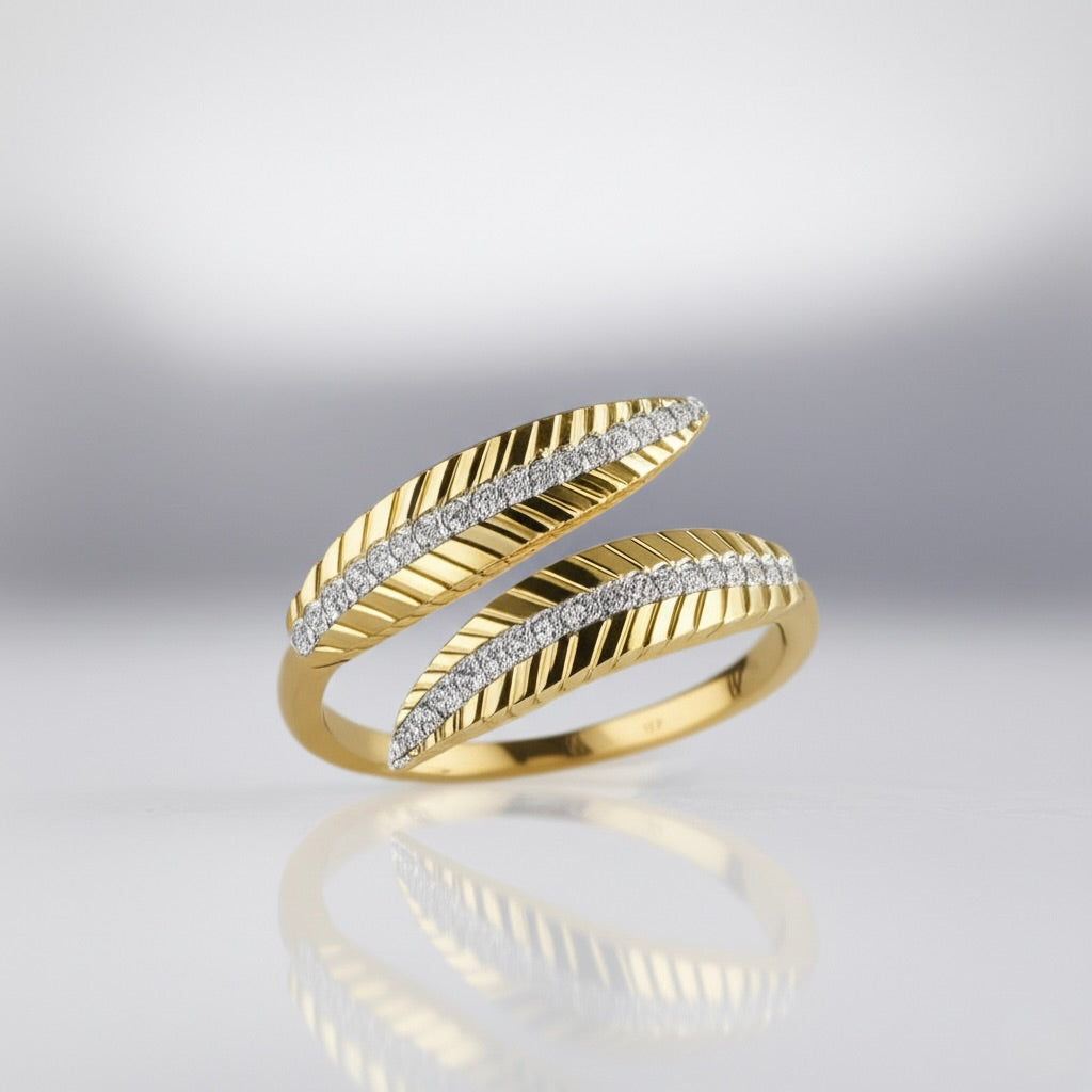 Gold ring with diamond accents on a reflective surface