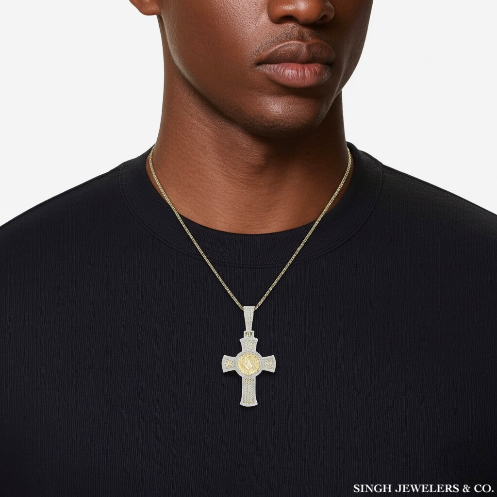 Man wearing a gold cross necklace on a plain background with 'Singh Jewelers & Co.' branding.