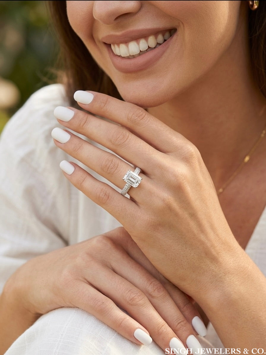 Woman wearing emerald cut moissanite engagement ring