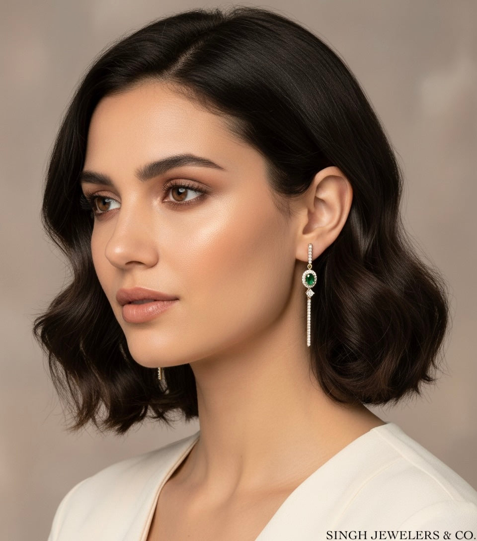 Woman wearing earrings with a neutral background, featuring Singh Jewelers & Co.