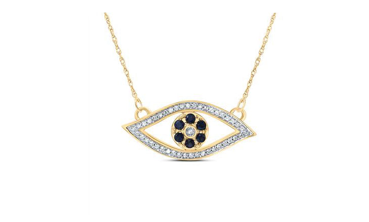 Gold necklace with an eye-shaped pendant featuring black stones and clear stones on a white background