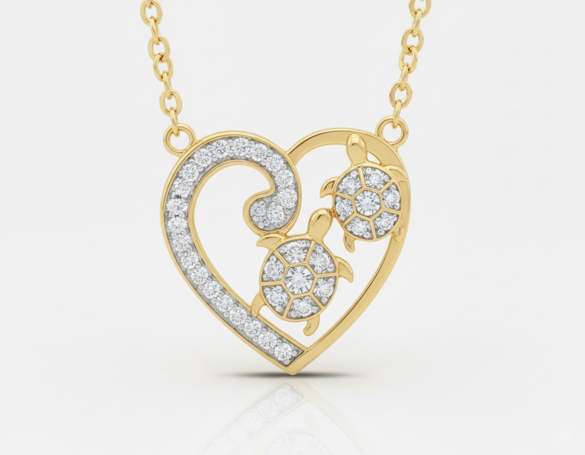 Heart pendant necklace in 10K yellow gold with two turtles inside, each featuring a natural diamond, on an 18-inch rolo link chain