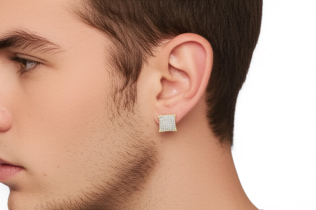 Close-up of a man wearing a square diamond earring on a white background