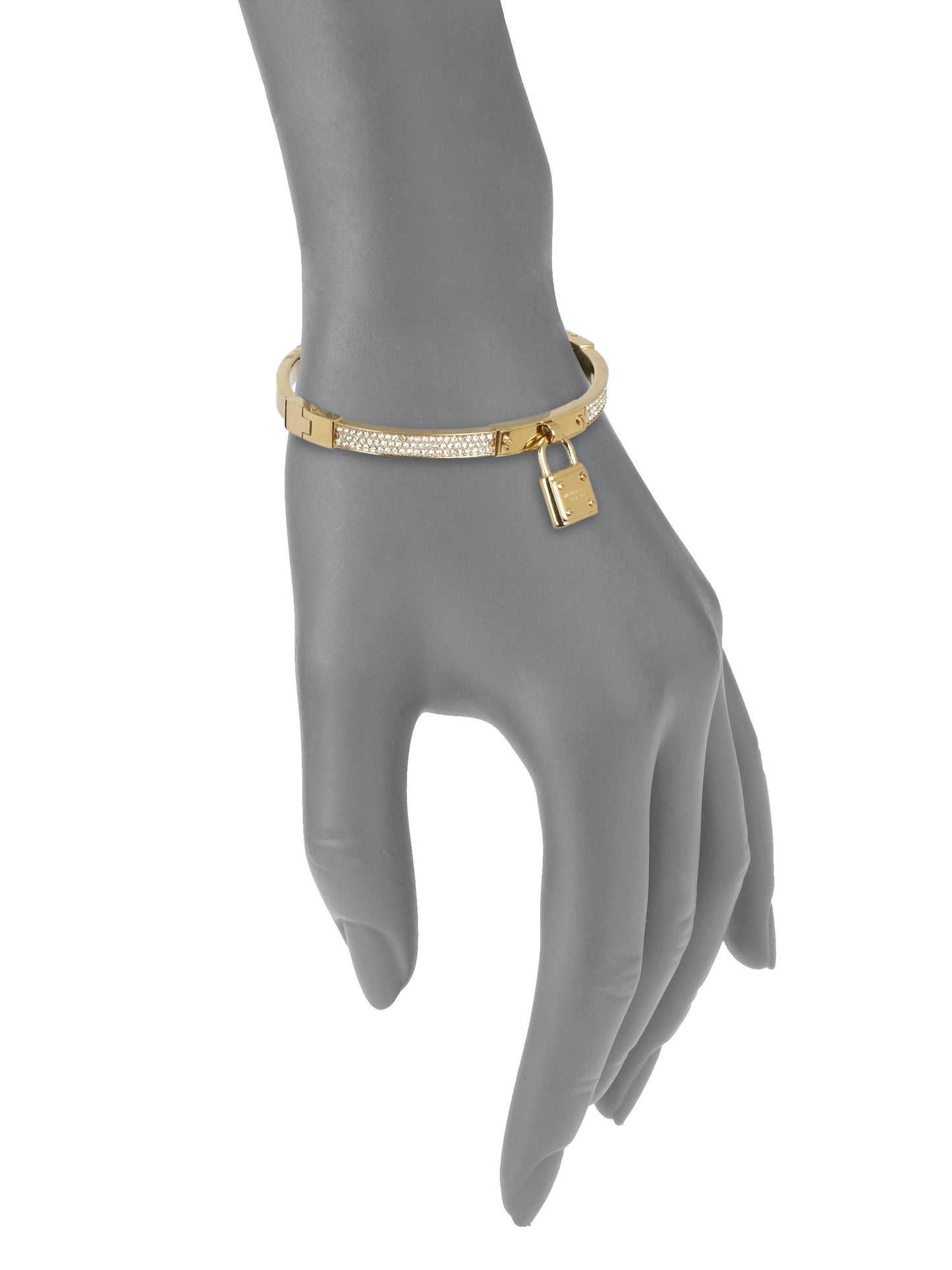 Michael Kors Gold Tone Bangle worn on a wrist to illustrate fit and style