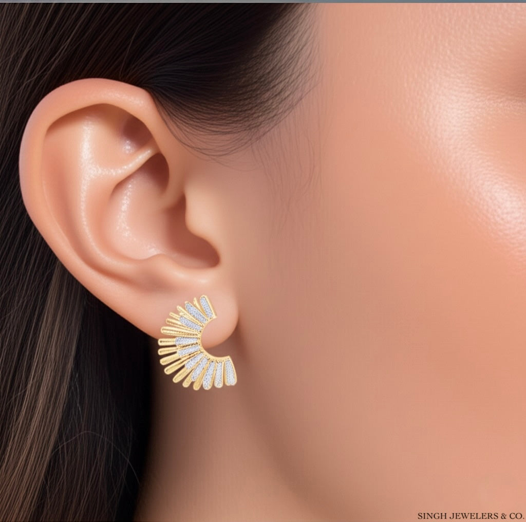 Model wearing 1/3 carat diamond fashion earrings in yellow gold