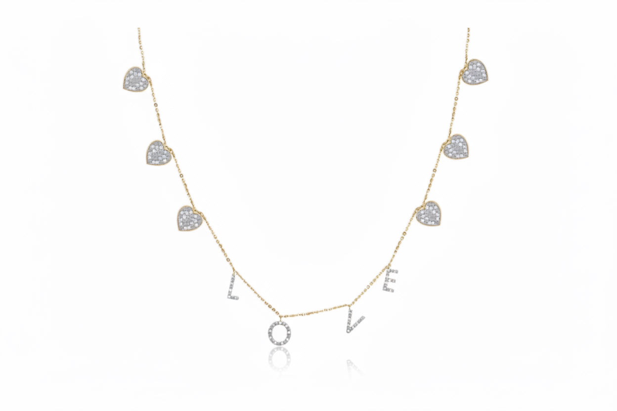 Necklace with heart-shaped pendants spelling 'LOVE' on a white background