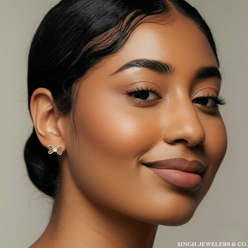 Close-up of a woman wearing earrings with a neutral background