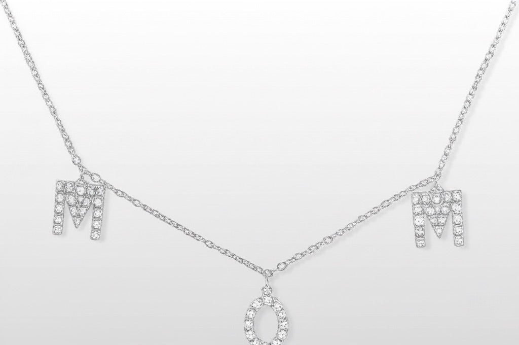 Silver necklace with 'MOM' letters on a white background