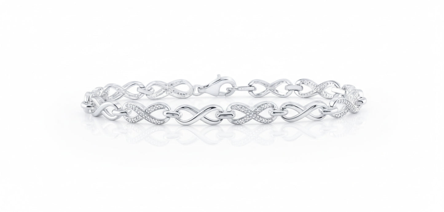 Silver bracelet with interlocking design on a white background