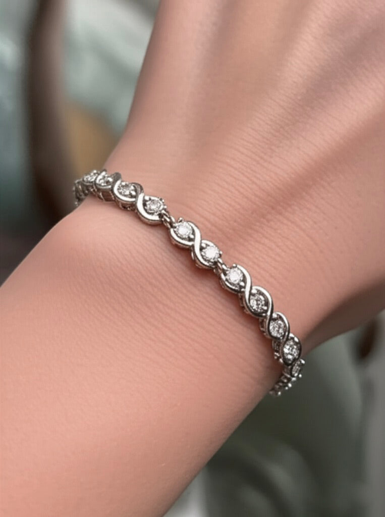 Model wearing sterling silver infinity moissanite bracelet – 2.80 CT sparkle