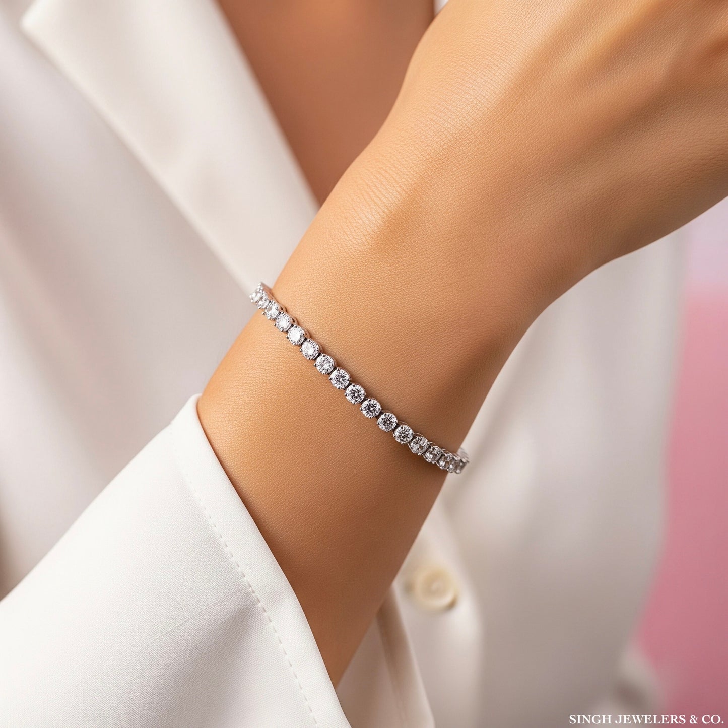6 inch moissanite tennis bracelet on female wrist in sterling silver