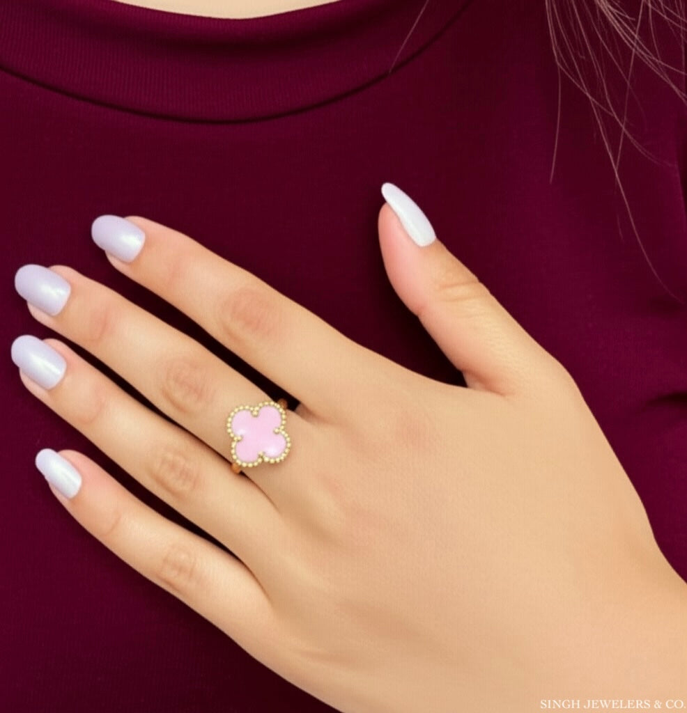 Woman wearing 10K gold pink clover ring