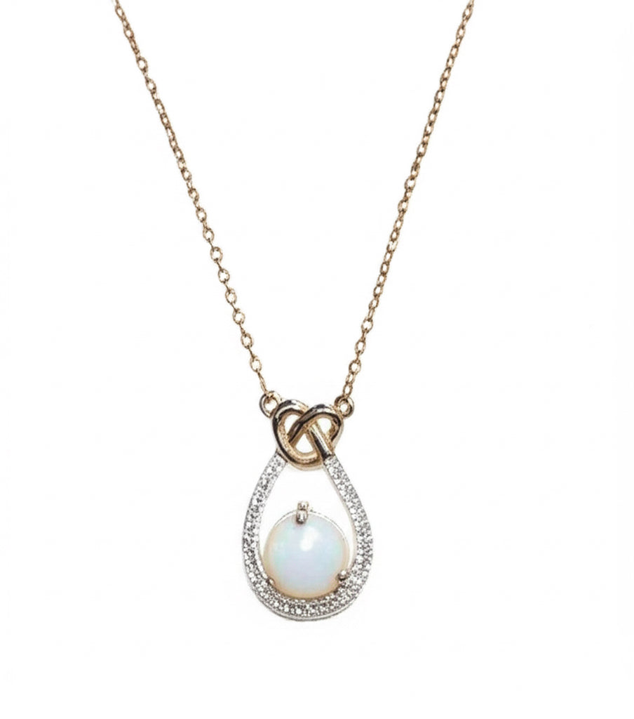 10k yellow gold necklace with opal and diamond cradle