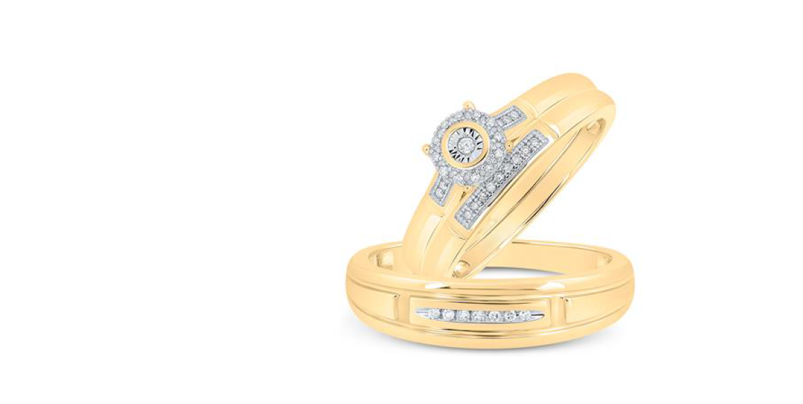 A halo diamond matching trio set with one large diamond centerpiece surrounded by two smaller diamonds, all set in yellow gold bands.