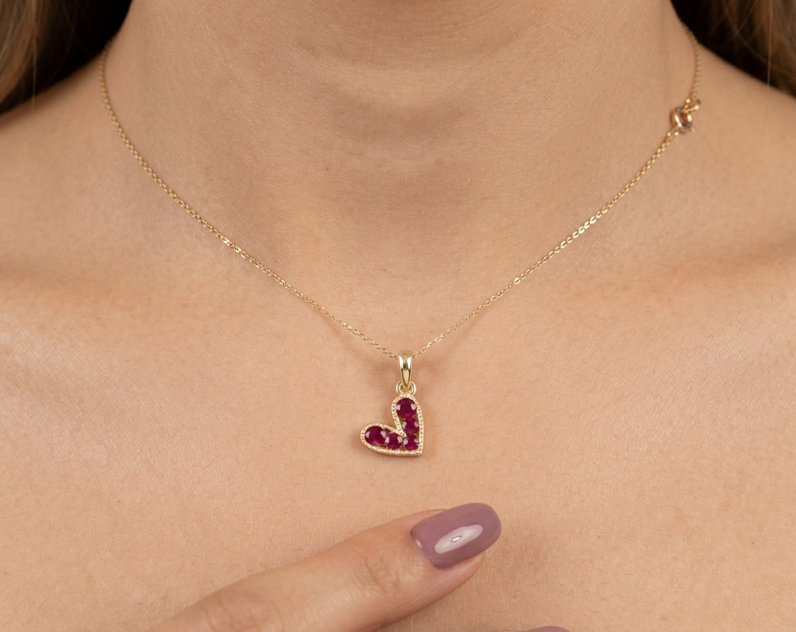 1/3 CTW natural ruby heart pendant in 14K gold on woman