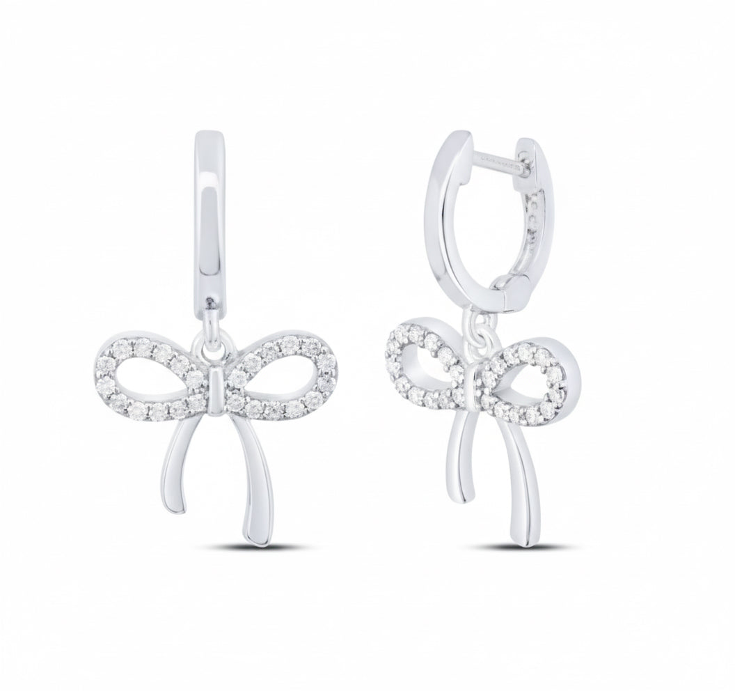 Sterling silver bow dangling earrings with 1/5 cttw natural diamonds, elegant and feminine design.